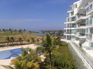 a resort with a swimming pool next to a building at Karibana Espectacular in Cartagena de Indias