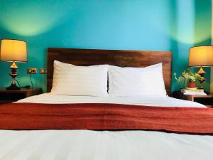 Łóżko lub łóżka w pokoju w obiekcie Kenting Cozy B&B