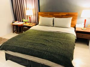 Łóżko lub łóżka w pokoju w obiekcie Kenting Cozy B&B