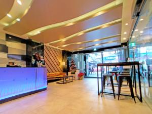 a lobby of a store with a table and chairs at Beauty Hotels Taipei - Hotel B6 in Taipei