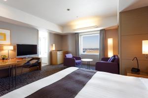 a hotel room with a bed and a television at Haneda Excel Hotel Tokyu Haneda Airport Terminal 2 in Tokyo