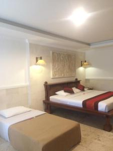 Postel nebo postele na pokoji v ubytování Melasti Beach Resort & Spa Legian