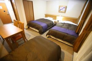 Letto o letti in una camera di Hotel 1-2-3 Maebashi Mercury