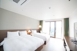 Giường trong phòng chung tại Dongwon Youthhostel