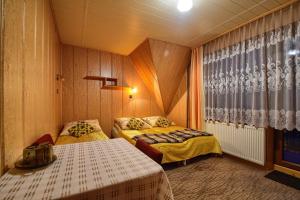 Postel nebo postele na pokoji v ubytování U Małgorzaty