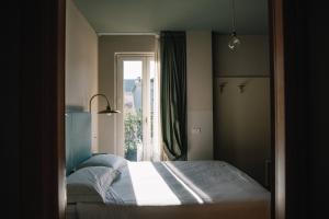 Postel nebo postele na pokoji v ubytování Hotel Torino