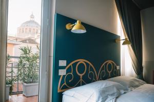 Postel nebo postele na pokoji v ubytování Hotel Torino