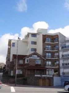 a tall apartment building on the side of a street at Hotel Amsterdam in Mar del Plata