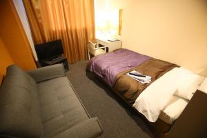 Letto o letti in una camera di Hotel 1-2-3 Maebashi Mercury