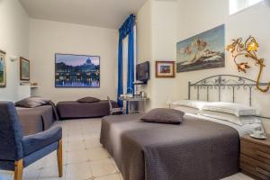 Postel nebo postele na pokoji v ubytování Roma Central Guest House