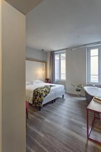 Postel nebo postele na pokoji v ubytování Hotel Torino