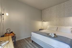 Postel nebo postele na pokoji v ubytování Hotel Torino