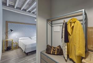 Postel nebo postele na pokoji v ubytování Hotel Torino