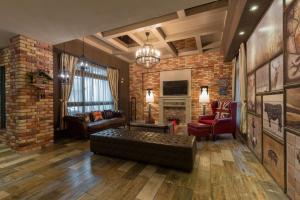 a living room with a couch and a brick wall at Ali Ba Ba B&B in Hualien City