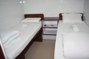 Voodi või voodid majutusasutuse Pay-Less Guesthouse (7/F A9) toas