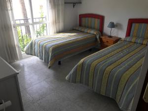 A bed or beds in a room at Casa playa el Torreon