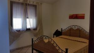 Ένα ή περισσότερα κρεβάτια σε δωμάτιο στο casa Angy