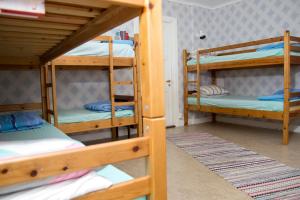 Postel nebo postele na pokoji v ubytování Örtagården