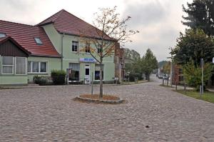 a tree in the middle of a cobblestone street at Ferienhaus Himmelpfort SEE 8861 in Pian