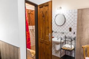 a bathroom with a toilet and a sink at Mila Apartments in Prague