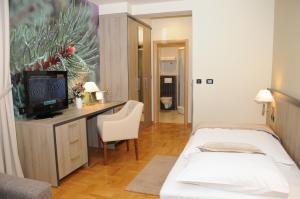 Postel nebo postele na pokoji v ubytování Hotel Calypso