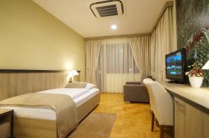 Postel nebo postele na pokoji v ubytování Hotel Calypso