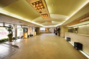 an empty lobby of a building with a lobby at Ryugu Hotel in Nishio