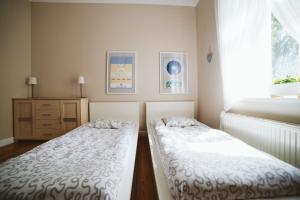 Posteľ alebo postele v izbe v ubytovaní Kamienica Ogrodowa