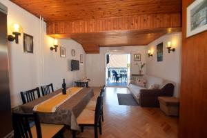 a living room with a table and a couch at Apartment Mimica-Croatia , Omis , Center in Omiš
