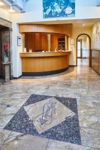 a lobby with a star on the floor of a building at Hotel Zur Traube in Velbert