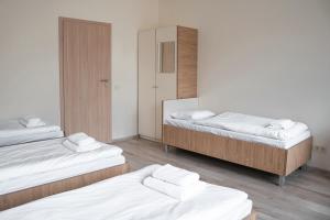 Postel nebo postele na pokoji v ubytování Bella Jūrmala Hotel