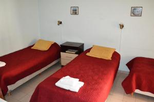 Una cama o camas en una habitación de Ventia Hotel Comodoro