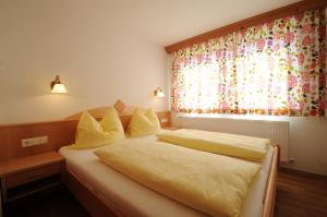 Een bed of bedden in een kamer bij Ferienhaus Hubertus - PRECHTLHOF