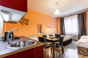 Postel nebo postele na pokoji v ubytování Rezidence Davids Apartments