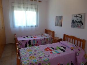 Postel nebo postele na pokoji v ubytování Rentalmar Villa California + 14 fotografií