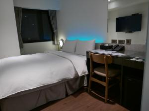 Postel nebo postele na pokoji v ubytování 泊居旅店二館 Oursinn Hotel 2 + 37 fotografií
