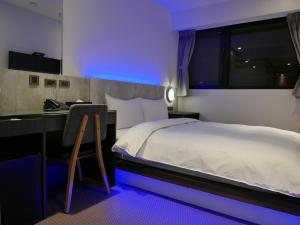 Postel nebo postele na pokoji v ubytování 泊居旅店二館 Oursinn Hotel 2