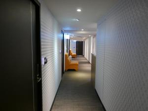 Postel nebo postele na pokoji v ubytování 泊居旅店二館 Oursinn Hotel 2