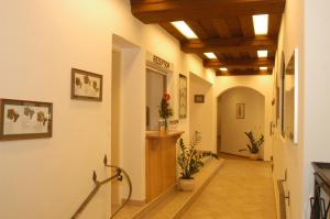 a hallway in a building with wooden ceilings at Weingut-Pension Stockingerhof in Dürnstein