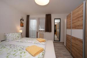 Säng eller sängar i ett rum på Apartments Obernosterer - Großglockner