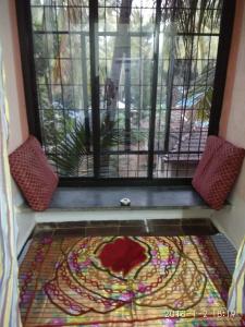 a room with a window with a mandala on the floor at Sobitai in Palolem