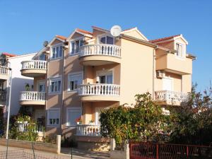 a building with balconies on the side of it at Apartment Bilac in Vodice