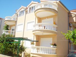 a building with balconies on the side of it at Apartment Bilac in Vodice