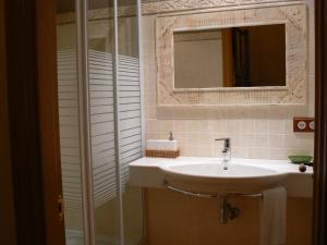 a bathroom with a sink and a mirror at Gauach in Bossòst