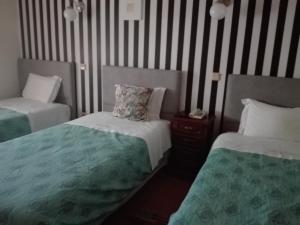 Katil atau katil-katil dalam bilik di Hotel Kamanga