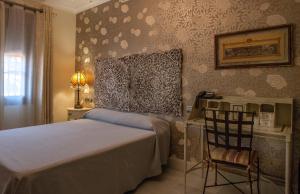 Łóżko lub łóżka w pokoju w obiekcie Hotel Coral Playa