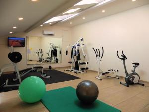 a gym with exercise bikes and a ball on the floor at Domaine de Gavaudun in Gavaudun