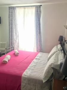 Postel nebo postele na pokoji v ubytování Agriturismo La Ferriera