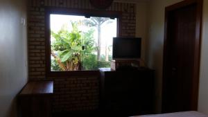 TV/trung tâm giải trí tại Casa da Márcia - Guarda do Embaú