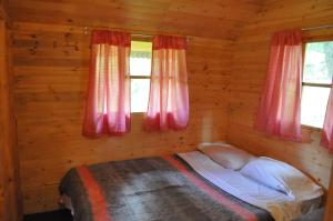 Postel nebo postele na pokoji v ubytování Chalets Amarelo